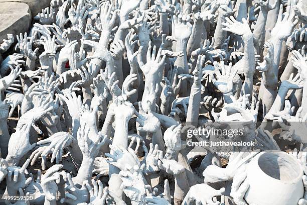 symbolic hell in wat rong khun - wat rong khun stock pictures, royalty-free photos & images