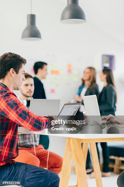 programmers at work in their office. - imagination technology stock pictures, royalty-free photos & images