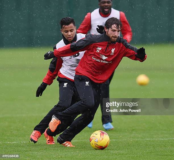 Joe Allen and Allan Rodrigues de Souza of Liverpool during a training session at Melwood Training Ground on November 30, 2015 in Liverpool, England.