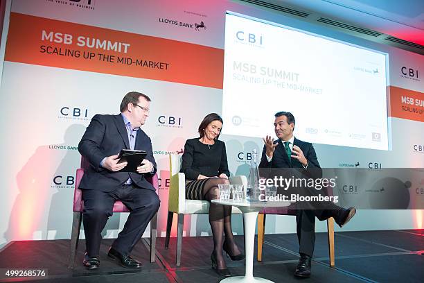 Antonio Horta-Osorio, chief executive officer of Lloyds Banking Group Plc, right, gestures as he speaks during a panel discussion with Carolyn...