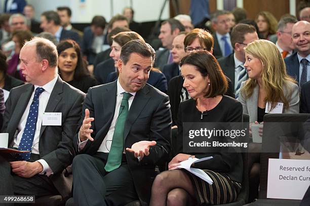 Antonio Horta-Osorio, chief executive officer of Lloyds Banking Group Plc, left, gestures as he speaks to Carolyn Fairbairn, director general of...