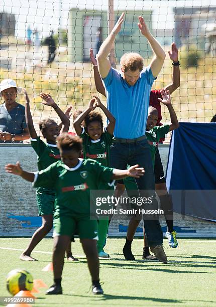 Prince Harry takes part in a football training session with children at Football For Hope Centree in Khayelistsha during an official visit to Africa...