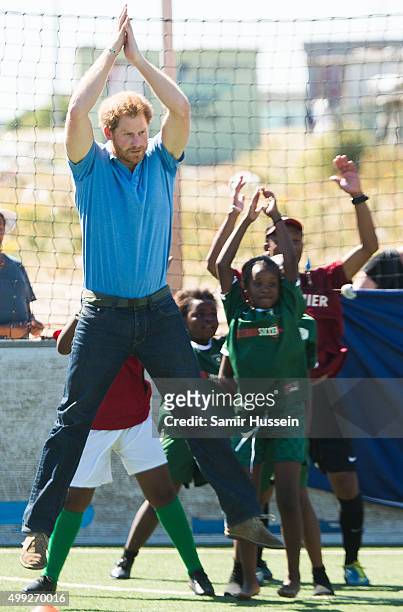 Prince Harry takes part in a football training session with children at Football For Hope Centree in Khayelistsha during an official visit to Africa...