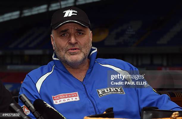 John Fury, the father of Britain's world heavyweight champion Tyson Fury talks during a press conference in Bolton, north west England on November...