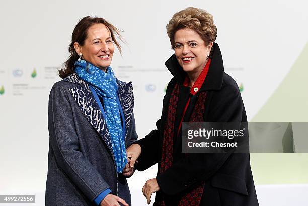 Segolene Royal, French Minister of Ecology, Sustainable Development and Energy welcomes Brasilian President Dilma Rousseff as he arrives for the...