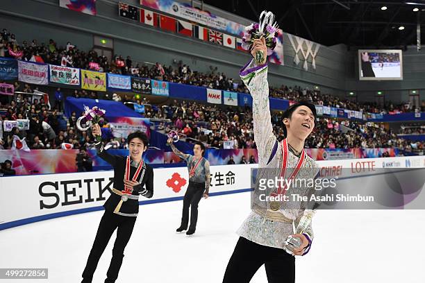 Gold medalist Yuzuru Hanyu of Japan celebrates after the medal ceremony for the Men's Singles during day two of the NHK Trophy ISU Grand Prix of...
