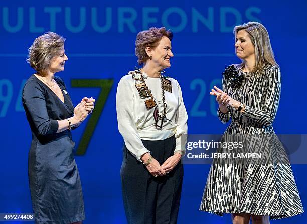 Prince Bernhard Culture Foundation Prize director Adriana Esmeijer and Dutch Queen Maxima applaud Dutch architect Francine Houben after awarding her...