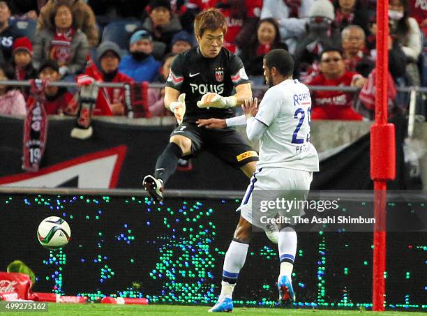 Patric of Gamba Osaka scores his tem's third goal during the J.League Championship Semi Final match between Urawa Red Diamonds and Gamba Osaka at...