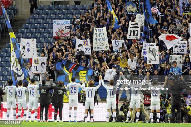 Gamba Osaka players celebrate after their 3-1 win in the J.League Championship Semi Final match between Urawa Red Diamonds and Gamba Osaka at Saitama...