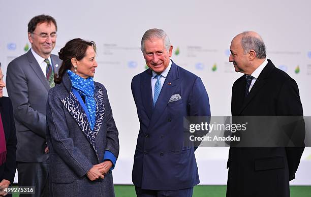 Britain's Prince Charles is greeted by French Minister of Ecology, Sustainable Development and Energy, Segolene Royal and French Foreign Minister...