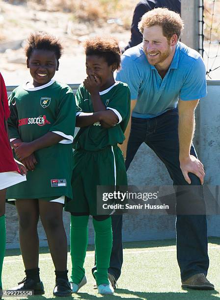 Prince Harry takes part in a football training session with children at Football For Hope Centre in Khayelistsha during an official visit to Africa...