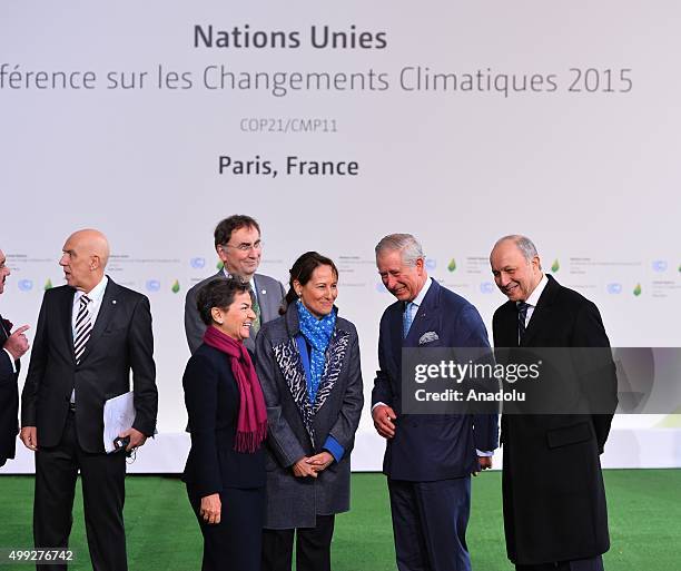 Britain's Prince Charles is greeted by French Minister of Ecology, Sustainable Development and Energy, Segolene Royal , French Foreign Minister...