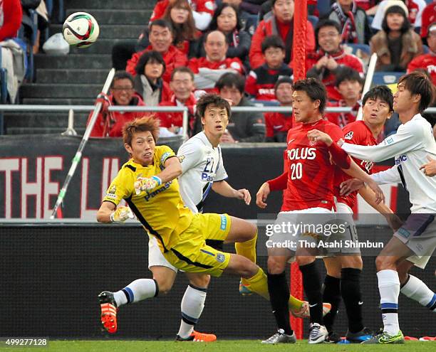 Masaaki Higashiguchi of Gamba Osaka clears the ball during the J.League Championship Semi Final match between Urawa Red Diamonds and Gamba Osaka at...