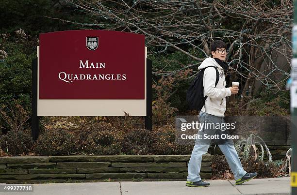 Pedestrians walk past an entrance to the Main Quadrangles on the Hyde Park Campus of the University of Chicago on November 30, 2015 in Chicago,...