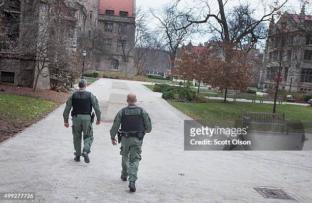 Members of the Chicago Police Department SWAT team patrol the Main Quadrangles on the Hyde Park Campus of the University of Chicago on November 30,...