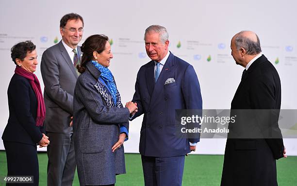 Britain's Prince Charles is greeted by French Minister of Ecology, Sustainable Development and Energy, Segolene Royal as French Foreign Minister...