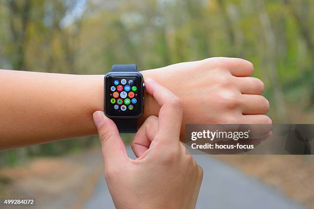 using apple watch in nature - apple watch heart stock pictures, royalty-free photos & images