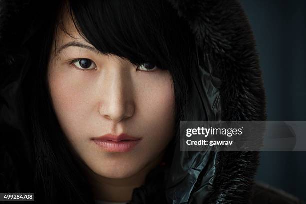 close-up portrait of an asian teenage girl looking at camera. - girl mugshots stock pictures, royalty-free photos & images