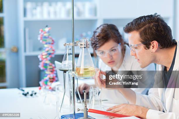 university chemistry laboratory research students working in class together - chemistry class stock pictures, royalty-free photos & images