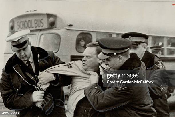 Police Grab Unionist George Ingham; during picket line violence outside Chelmsford District Composite School in Sudbury area. Steelworker Ingham....
