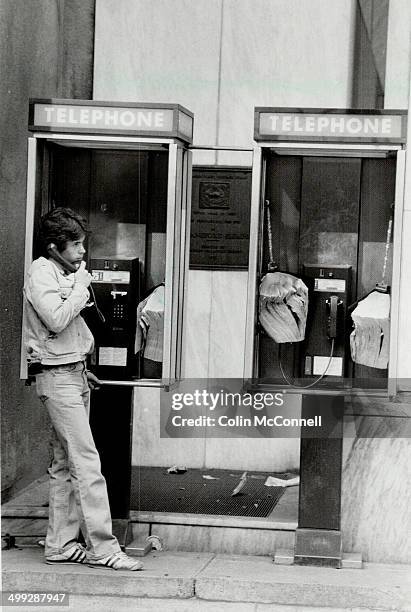 Peek-a-boo: Bell Canada says phone booths at corner of Yonge and Adelaide don't block view of Fleming memorial plaque; and there's no need to move...