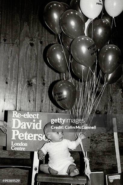 Baby held balloons in Peterson's home riding