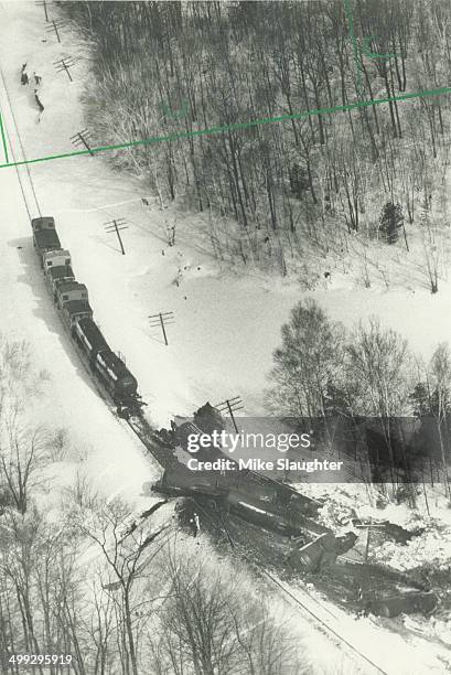 Acid leak: A section of a 39-car CP train lies in a tangled mess near Parry Sound after a 15-car derailment at 5.50 yesterday morning. CP officials...