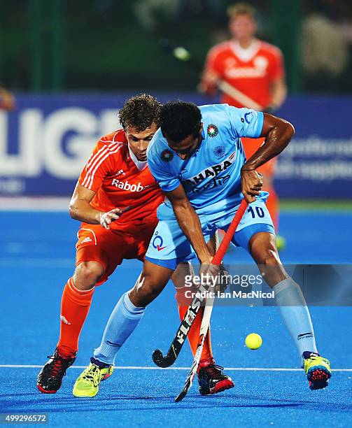 Constantijn Jonker of Netherlands vies with Dharamvir Singh of India during the match between Netherlands and India on day four of The Hero Hockey...