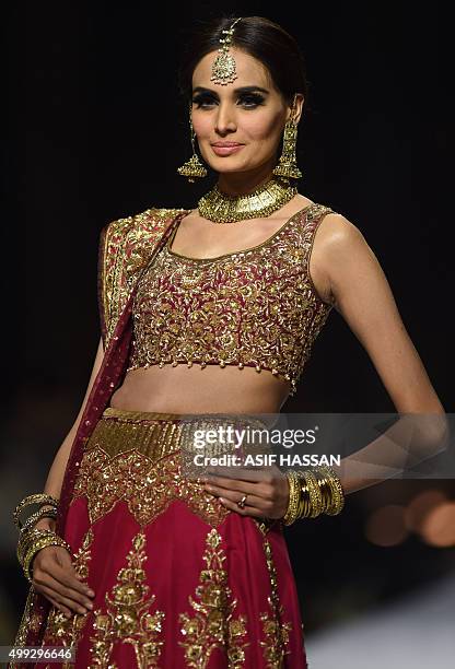 Model presents a creation by Pakistani designer Zaheer Abbas on the final day of the Fashion Pakistan Week in Karachi on November 30, 2015. AFP PHOTO...