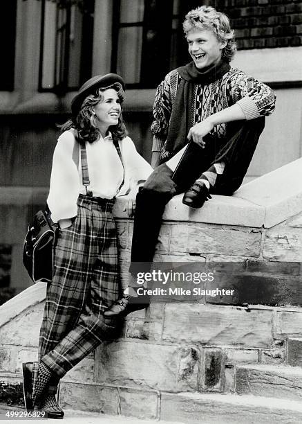 Preppy patterns: She wears blue plaid cropped pants with suspenders; $50; and white cotton shirt; $35.