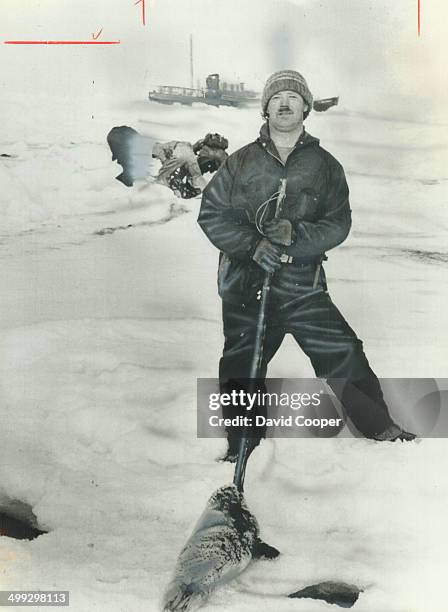 The kill. Roger Le Tomplier; one of 200 sealers hunting off Labrador; poses with the carcass of a 1-week-old pup. Christie Blatchford writes from the...
