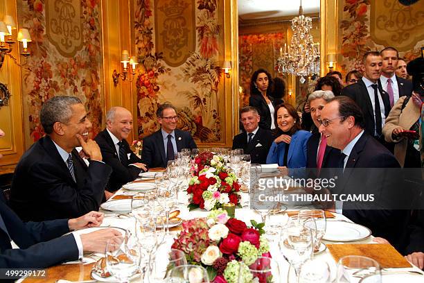 President Barack Obama and French President Francois Hollande have dinner at the Ambroisie restaurant in Paris, with Secretary of State John Kerry ,...