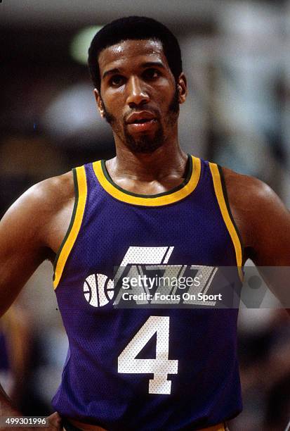 Adrian Dantley of the Utah Jazz looks on against the New Jersey Nets during an NBA basketball game circa 1980 at the Rutgers Athletic Center in...