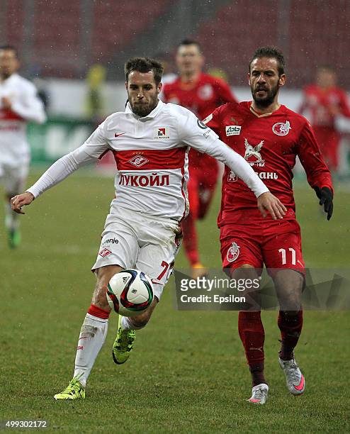 Marko Devic of FC Rubin Kazan is challenged by Kirill Kombarov of FC Spartak Moscow during the Russian Premier League match between FC Rubin Kazan...
