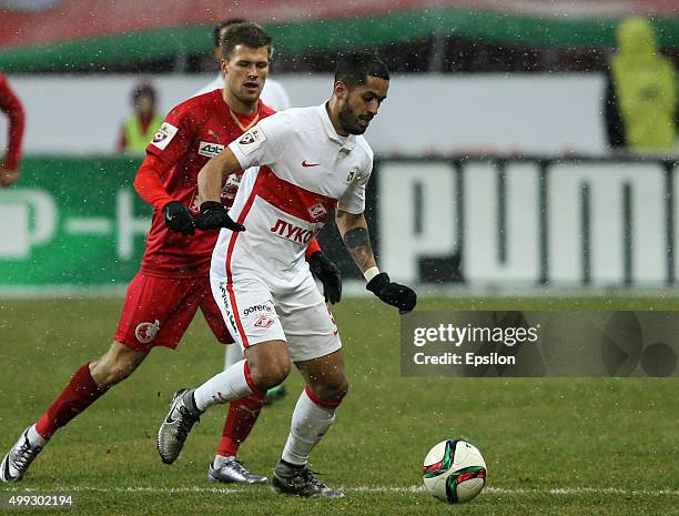 Maksim Kanunnikov of FC Rubin Kazan is challenged by Romulo Borges of FC Spartak Moscow during the Russian Premier League match between FC Rubin...