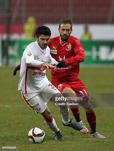 Marko Devic of FC Rubin Kazan is challenged by Serdar Tasci of FC Spartak Moscow during the Russian Premier League match between FC Rubin Kazan and...