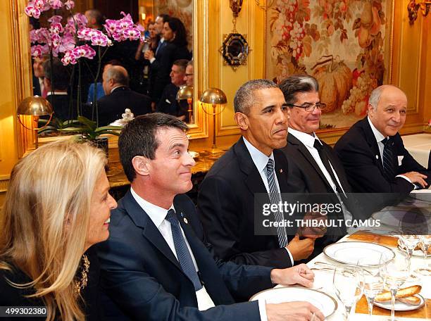 President Barack Obama and French President Francois Hollande have dinner at the Ambroisie restaurant in Paris, with French Foreign Minister, Laurent...