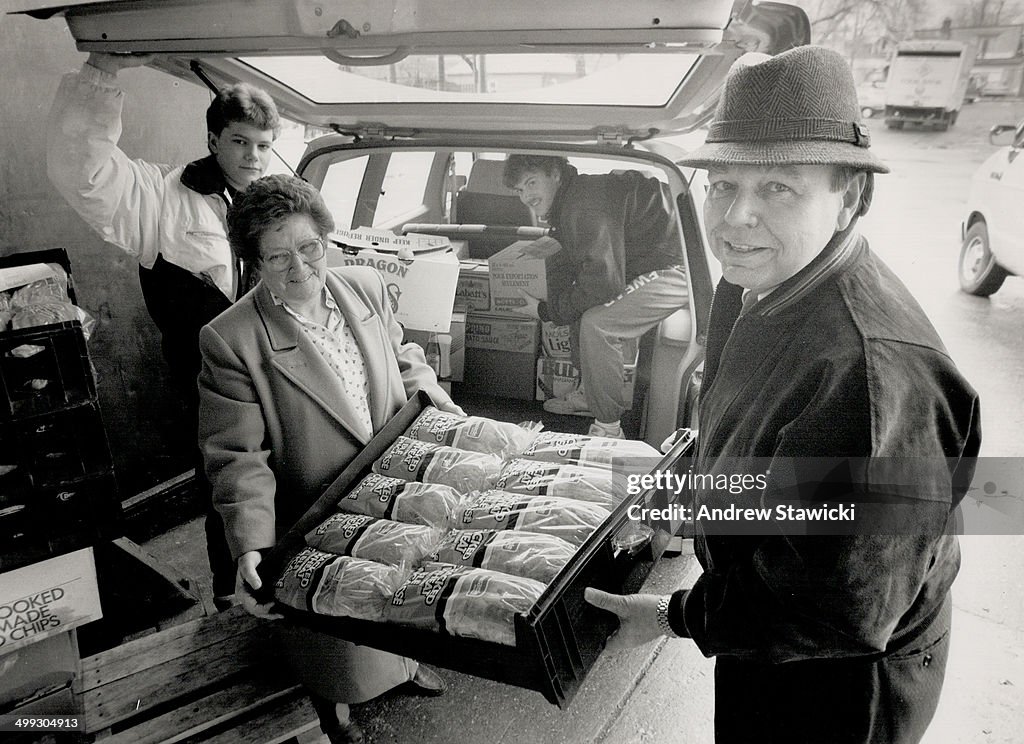 Food Relief: Volunteers Steve Varcoe; left; Ruth Christman and Robert Walker help Rev. George French...