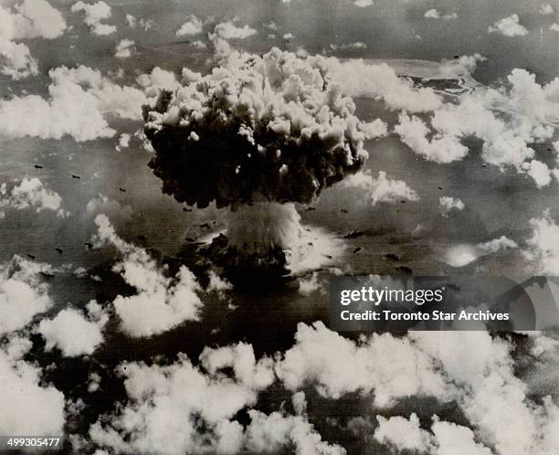 The Atomic Mushroom. The water in the stem-like, Half-mile-wide column, and in the mushroom top is beginning to fall back into Bikini Lagoon less...