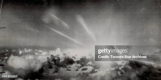 Blinding streamers of light accompanied the explosition of the first atomic bomb at Operation Crossroads in Bikini atoll. This photo, taken from the...