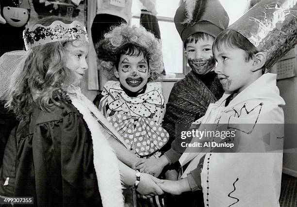 Beth David Synagogue students Amanda Fleischer as Queen Esther; left; Yoni Halpern as the clown; Jeremy Silver as Haman and Yoni Schumacher as King...