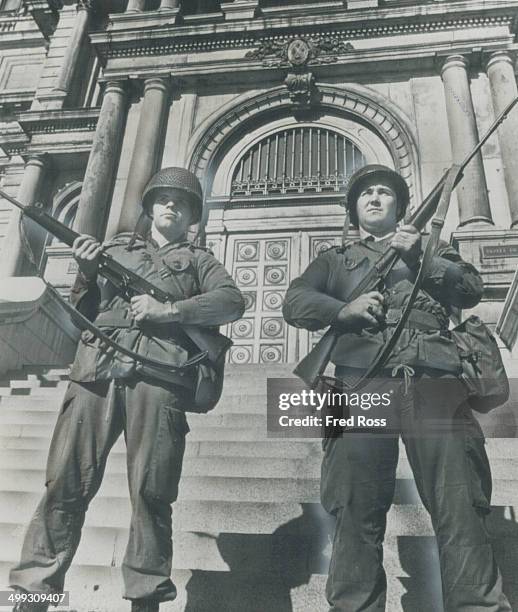 Renowned Van Doos - Members of the French-speaking Royal 22nd Regiment - stand on guard outside Montreal's city hall today maintaining a shaky peace...