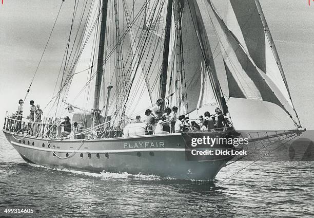 Lake Ontario beauty sails past; Under full sail; the 60-foot brigantine Playfair passes Toronto Island's Western Gap with 25 students aboard. The...