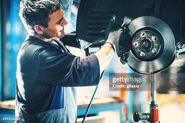 car braking system repair. - part of stockfoto's en -beelden
