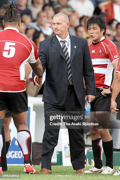 Japan head coach John Kirwan shakes hands with players after the match three of the Rugby World Cup 2007 between Australia and Japan at the Gerland...