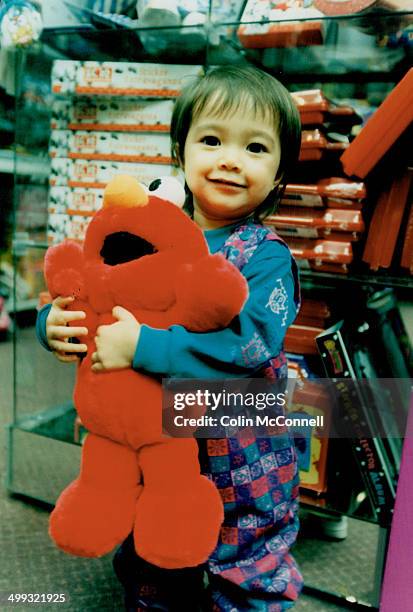 Nakita Byrne with Tickle Me Elmo doll