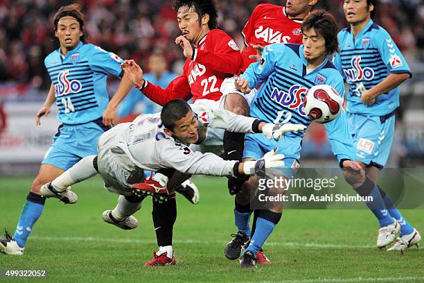 Takanori Sugeno of Yokohama FC and Yuki Abe of Urawa Red Diamonds compete for the ball during the J.League match between Yokohama FC and Urawa Red...