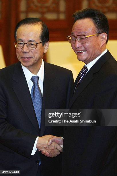 Japanese Prime Minister Yasuo Fukuda and Chairman and Party secretary of the Standing Committee of the National People's Congress Wu Bangguo shake...