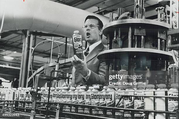Halt in use of Freon as a propellant in aerosol cans was announced by F. F. Wiley; president of S. C. Johnson & Son Ltd. Wiley is shown looking over...