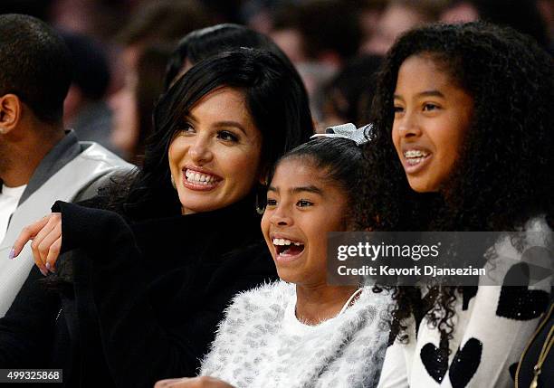 Wife Vanessa Laine Bryant and daughters Gianna Bryant and Natalia Bryant watch Kobe Bryant of the Los Angeles Lakers during the basketball game...